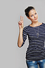 Mädchen zeigt mit zwei Fingern | Stock Foto