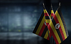 Small flags of Uganda on an abstract blurry | Stock Foto
