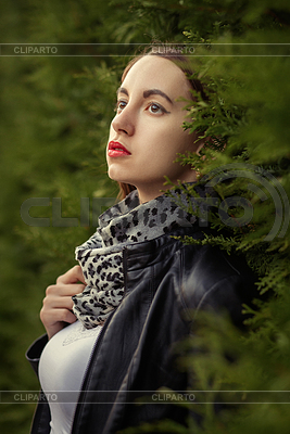 Attractive sad young woman in leather coat near | High resolution stock photo |ID 7440574