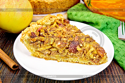 Pie with pumpkin and apples in plate on board | High resolution stock photo |ID 6452229