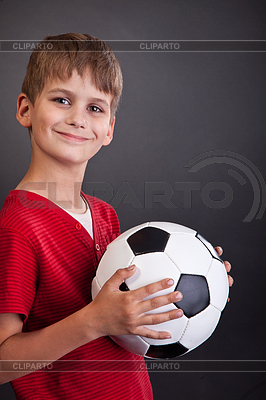 Cute boy is holding football ball. Soccer ball | High resolution stock photo |ID 3393789
