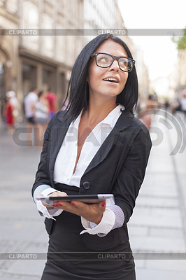 Businesswoman on street with tablet computer | High resolution stock photo |ID 3498186