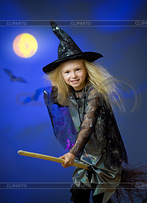 Girl dressed up as witch in night flying broom | High resolution stock photo |ID 3659564
