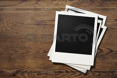 Polaroid photo frames on old wooden table | High resolution stock photo |ID 4647165