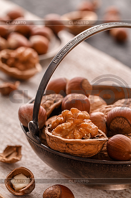 Different nuts on dark stone table. hazelnut, | High resolution stock photo |ID 6517118