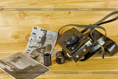 Old film camera in cover, photos and film on | High resolution stock photo |ID 5773482